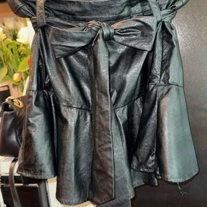 GLAM Black faux leather mini skirt, size small.‎